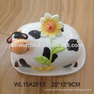 Hand painted cow shaped ceramic bread plate with flower